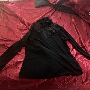 Long sleeve black blouse with a small turtle neck